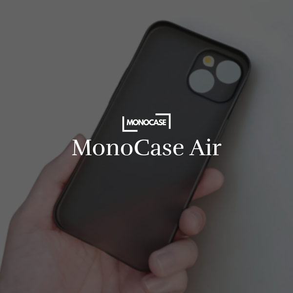 Hand holding black MonoCase Air phone case with dual camera cutout